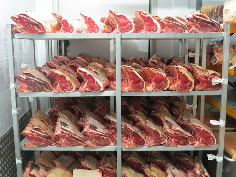 Image of beef maturing on a shelf at Campbells prime meats factory.
