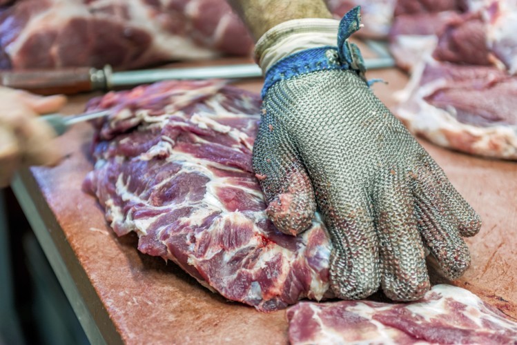 Image of catering butcher cutting harmony beef.